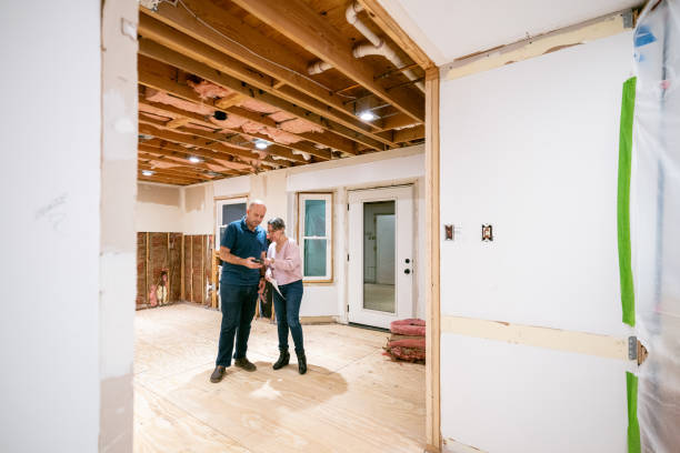 istock Couple supervising home renovation progress 2193127772