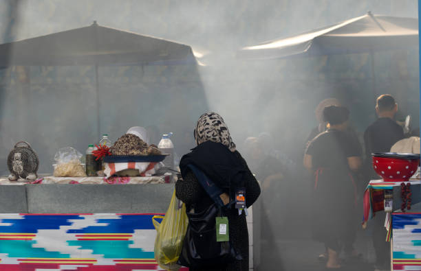 Tashkent, Uzbekistan, October 4 2024: unidentified worker makes the food in food court at Chorus Bazaar.  Chorus Bazaar is one of famous landmark in Uzbekistan