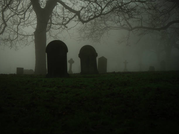 istock Eerie Graveyard in thick fog and mist 2193128972