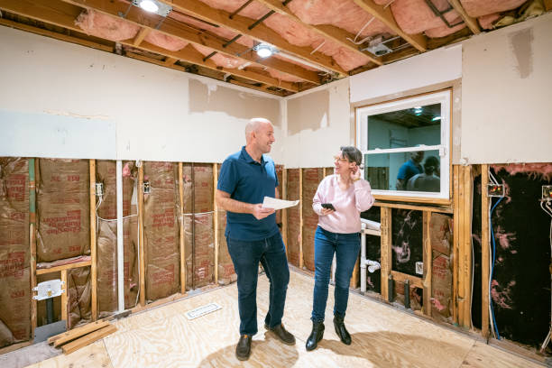 Couple supervising home renovation progress
