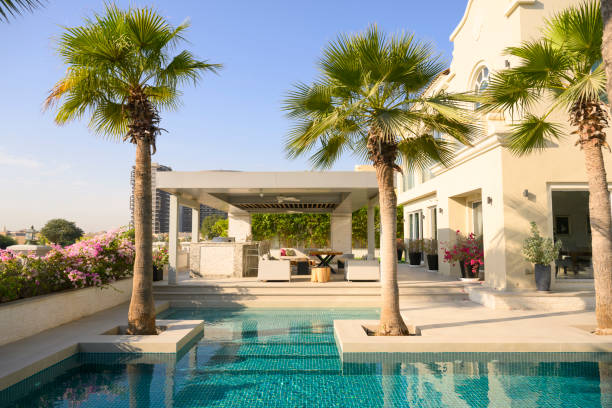 Luxury house with swimming pool and palm trees in Dubai
