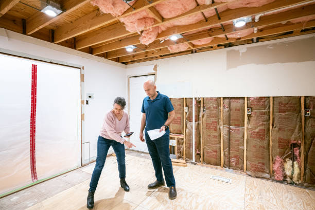 istock Couple supervising home renovation progress 2193130766
