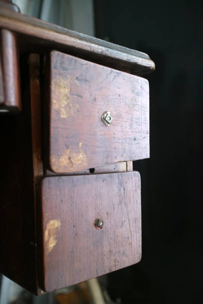 istock Two wooden box drawers, part of a traditional sewing machine compartment 2193131014