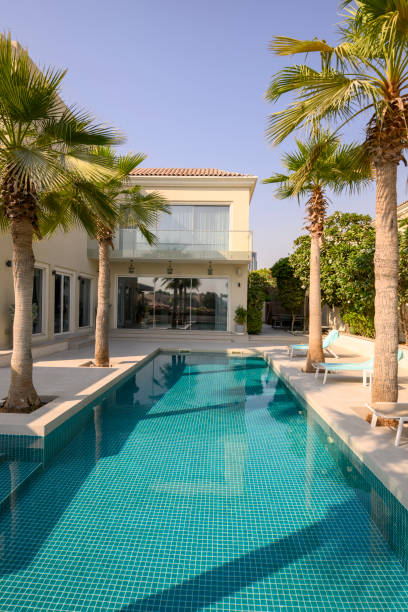 istock Swimming pool at luxury villa 2193131678