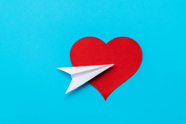 istock Paper airplane fly to red heart shape 2193133380