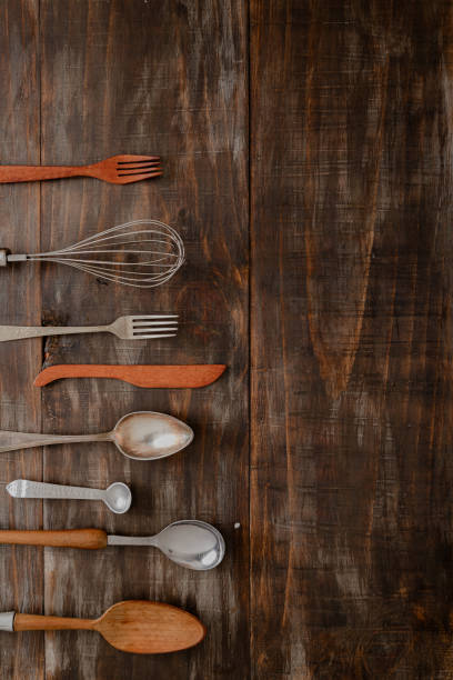 istock flat lay of different vintage cutlery items on dark wooden rustic board table 2193135792