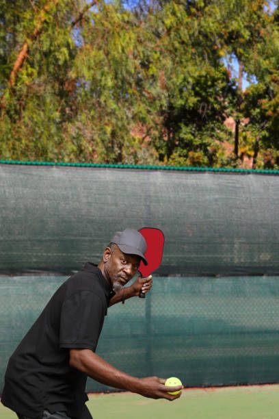 istock Pickleball African American Man Serves Vertical 2193138065