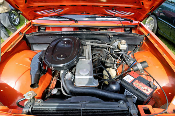 Weiterstadt, Germany September 22, 2024: Opel, , view into the opened engine compartment, from the front in orange classic cars at the Chromblitzen exhibition