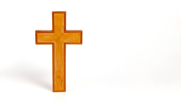 istock Wooden cross stands on a white surface 2193140461