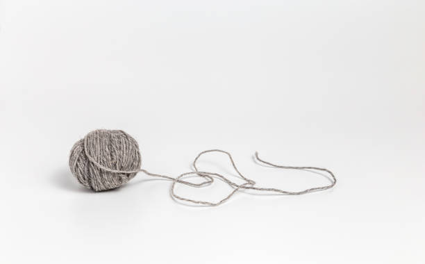 istock Ball of gray yarn on white background 2193140527