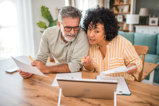 istock A middle-aged couple working on their monthly domestic finances 2193140932