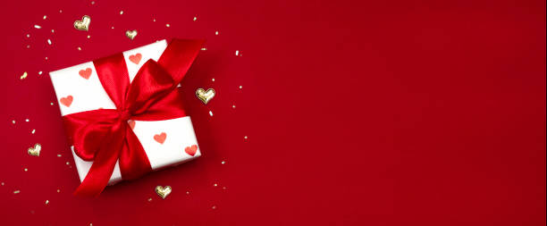 istock Red valentine's background empty copy space horizontal banner, gift box with bow top view.Christmas backdrop,holiday decor. 2193143566
