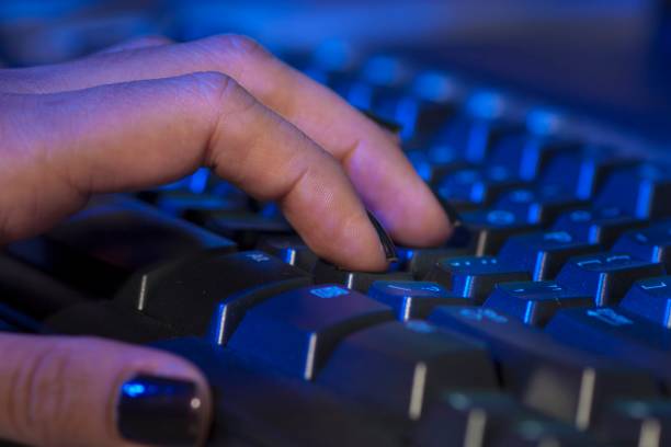 istock Closeup of woman's hand on computer keyboard 2193143836