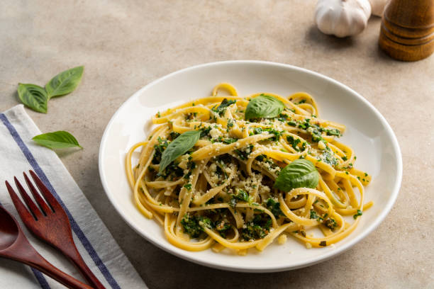 istock fettuccine pasta with kale walnut pesto sauce 2193144606