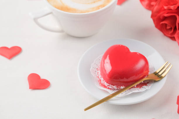 istock red heart shaped cake and coffee for valentines day on white table setting 2193145146