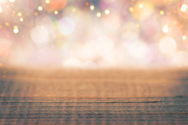 istock Festive wooden background with defocused shiny bokeh lights. 2193148195