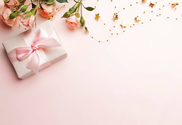 istock Gift box and flowers top view empty copy space background. Mother's day backdrop. Valentine's card. Pink romantic wallpaper.Women's day.Birthday. 2193149064
