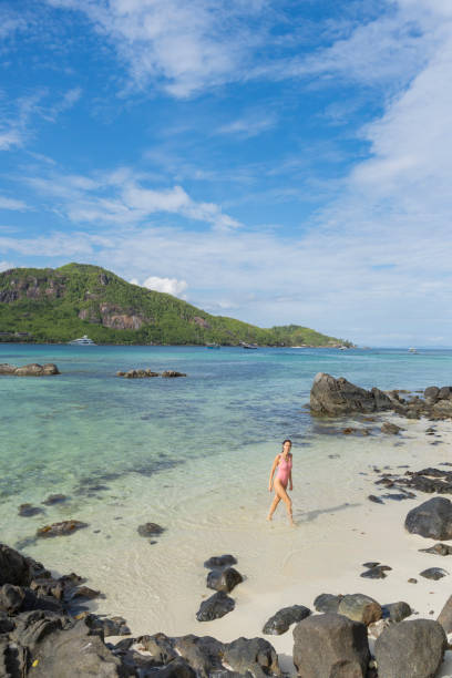 istock Elevated view of young woman on tropical beach 2193150829