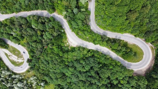istock Serpentine Road Through Verdant Hills 2193159365