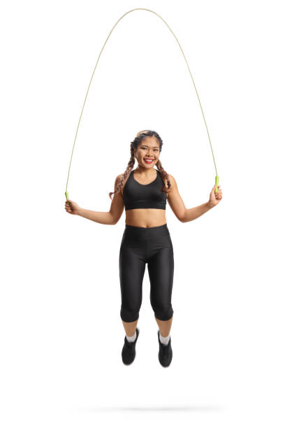 Young asian woman exercising with a skipping rope isolated on white background