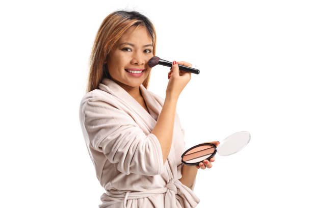 istock Asian woman applying blusher with a brush 2193160716