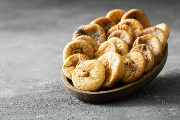 istock Sun dried figs on rustic table, organic tasty fruits, healthy dry fruit concept 2193163073