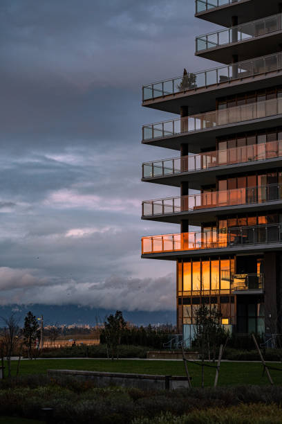 Luxury Riverside Apartment Glass Reflecting Vibrant Sunset Colors