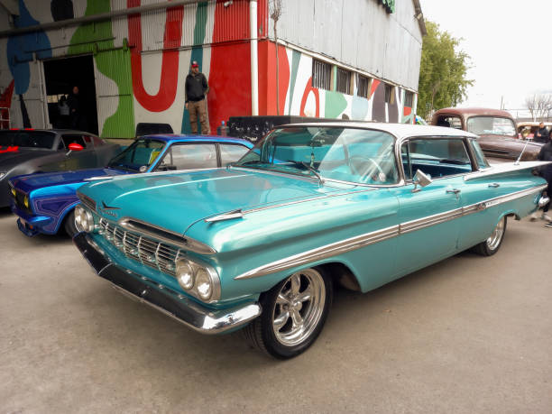 Avellaneda, Argentina - Aug 25, 2024: old sky blue shiny 1959 Chevrolet Impala hardtop sedan at a classic car show. Copy space