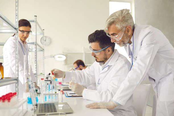 istock Group of scientists working in laboratory, doing research and using modern lab equipment 2193167820
