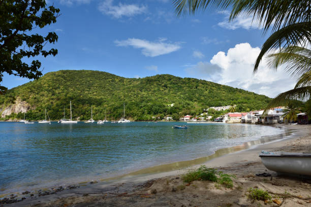Bay of Deshaies with beach and restaurants located in basse-Terre, Guadeloupe. Deshaies is a popular travel destination for tourists.