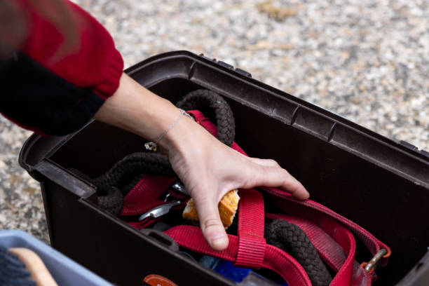 istock Climber picking up bread crumbs from gear box after lunch 2193172156