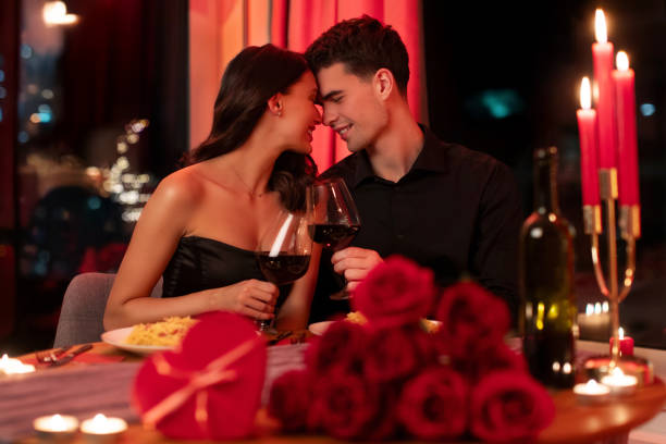 istock Romantic couple bonding, having dinner in restaurant, enjoying tender moment during Valentine's day celebration 2193175360