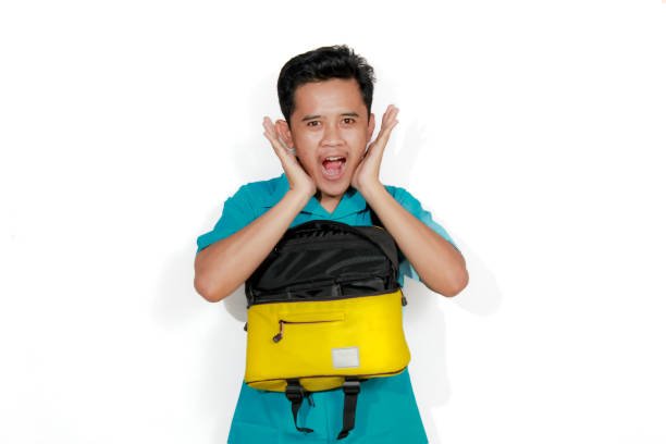 istock Asian man surprised his bag is open isolated on white background 2193176764