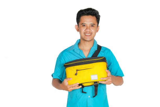 istock Asian man carrying yellow bag showing happy expression isolated on white background 2193176789