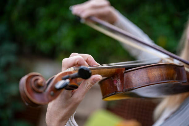 istock Closeup of violinist hands playing the instrument 2193178156