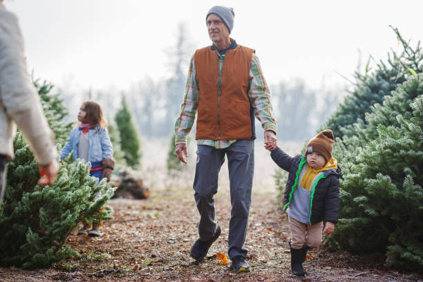 istock Multi-generation family selecting Christmas tree at farm in Oregon 2193180101