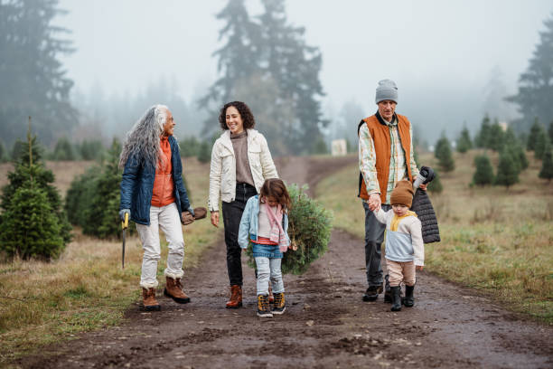 istock Multi-generation family at you-cut Christmas tree farm 2193180166