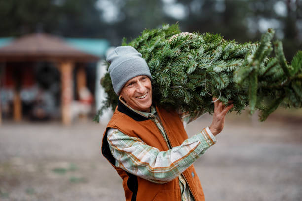 istock Vibrant senior man buying a Christmas tree 2193180174