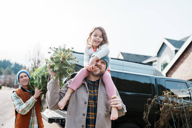 istock Multi-generation family bringing a Christmas tree home 2193180189