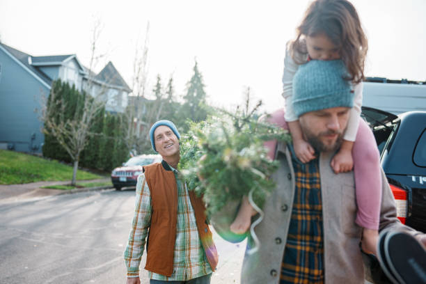 istock Active senior man and his family bringing a Christmas tree home 2193180194