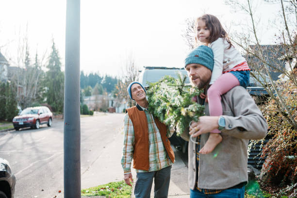 istock Active senior man and his family bringing a Christmas tree home 2193180195