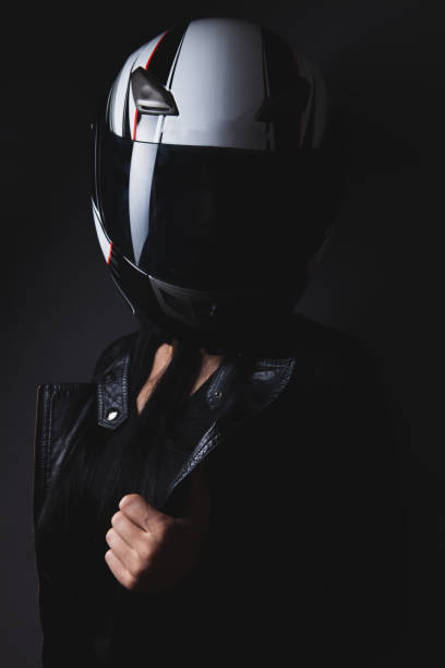 istock woman in a leather helmet with a motorcycle helmet. 2193181181