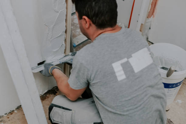 istock One young man is plastering a doorway. 2193181292