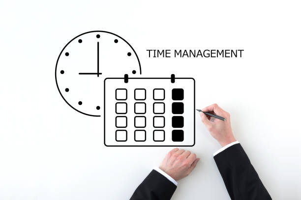 Businessman’s hand drawing clock and calendar icon