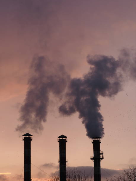 istock smoke from factory chimneys against red sky 2193188540