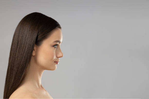 istock Attractive young girl on a gray background. Botox concept 2193190558