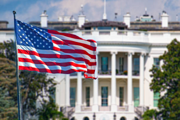 istock American Flag in front of the White House 2193193004