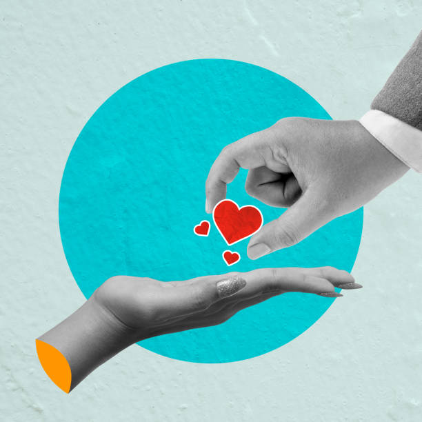 istock A human hand gives a red heart to others on a colored background 2193196867