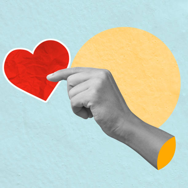 istock A human hand holding a red heart on a colored background 2193196921