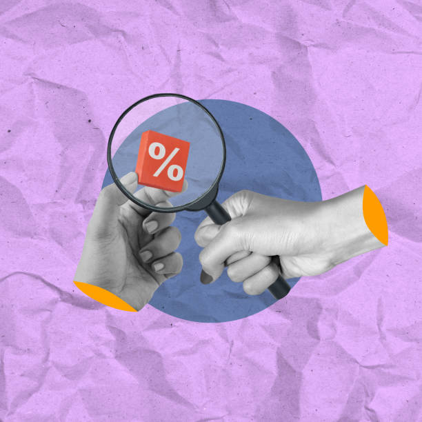 istock A human hand looking at a percentage symbol through a magnifying glass 2193196940